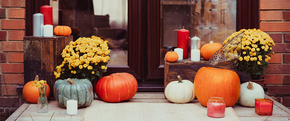 Candles and pumpkins on porch